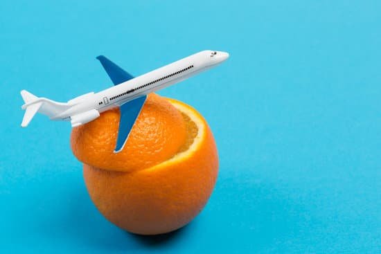 canva a small plane on an orange flies up like a concept of traveling by air