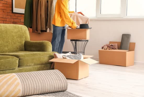 canva a woman unpacking in a new apartment MAD9cH91h0k