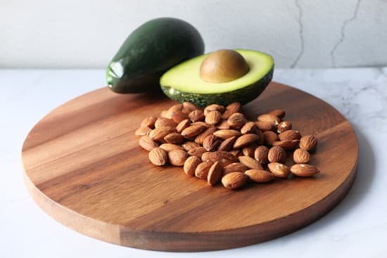 canva almonds and avocado on chopping board MAD98IzjQJU