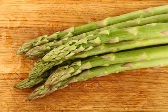 canva asparagus on a cutting board MAD SjHeEag