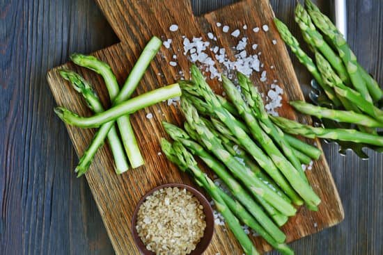 canva asparagus with sea salt on cutting board MAD Qicsn38