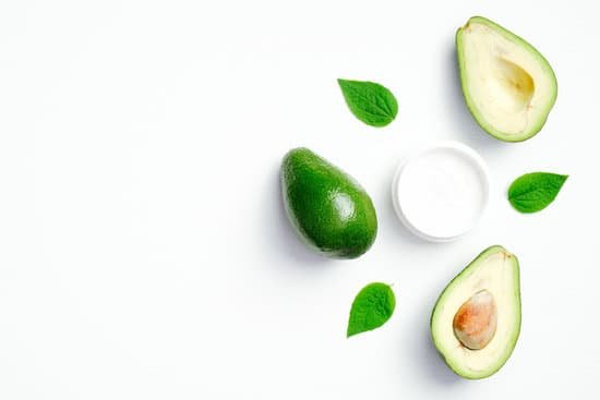 canva avocado and face cream on white background