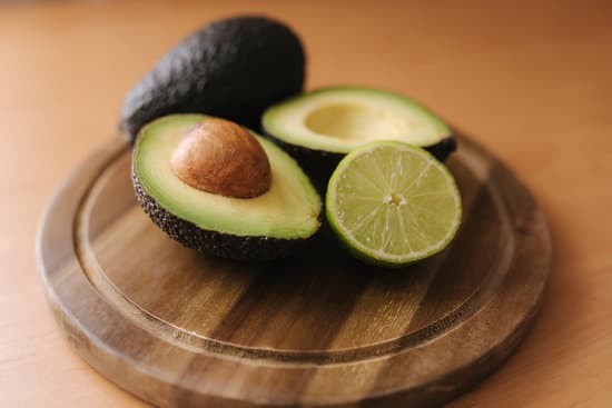 canva avocado and lime halves on wooden board MAERFTmwV o