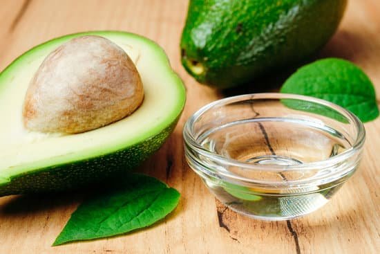 canva avocado oil and fruit on a wooden table MAD7C9Pl02g