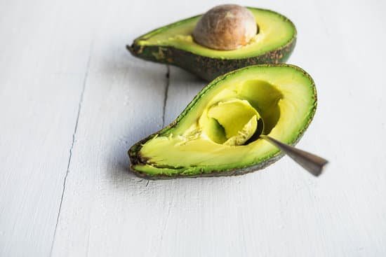 canva avocado on white wooden table MAEElUUIyQo