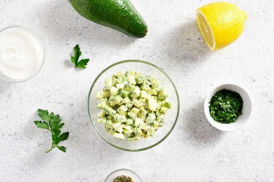 canva avocado salad in bowl with ingredients flatlay MAENbK7n6NU