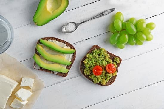 canva avocado sandwiches with grapes and cheese on wooden table MAD Qt2WN3E