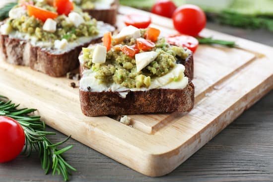 canva avocado sandwiches with tomatoes and mozzarella on cutting board MAD QnDNh7I