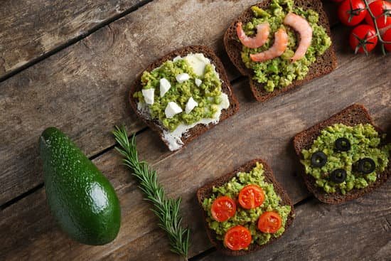 canva avocado sandwiches with vegetables on wooden table MAD QoPZPjA