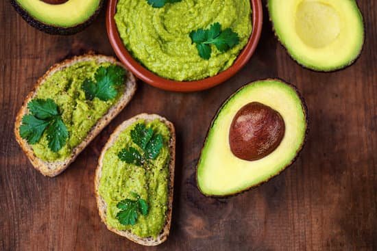 canva avocado toast on a wooden table MAEIZmPYC7w