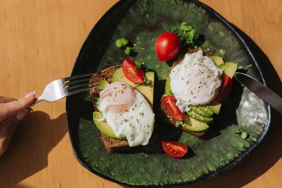 canva avocado toast with egg and tomatoes MAERFezZ0XA