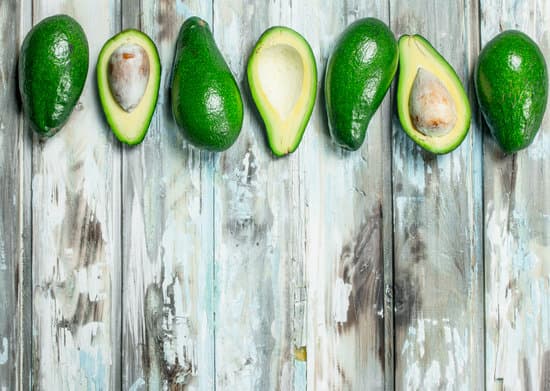 canva avocado whole and cut with bone. MAEPVCTsleY