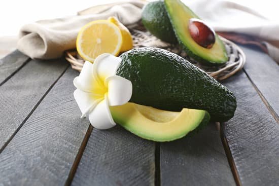 canva avocados and lemon on wooden table MAD Qkeupbg