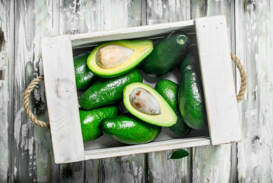canva avocados on a wooden crate flatlay