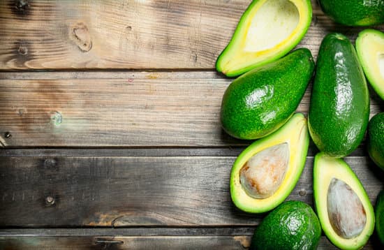 canva avocados on a wooden table MAEPufJ3GbE