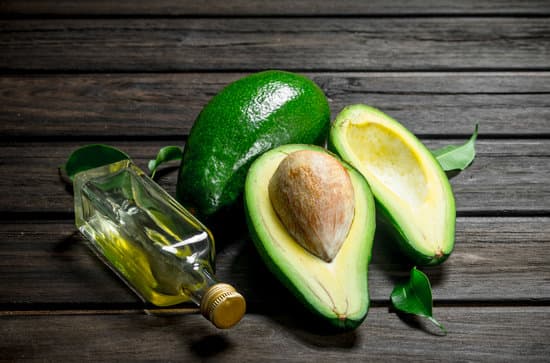 canva avocados with a bottle of oil