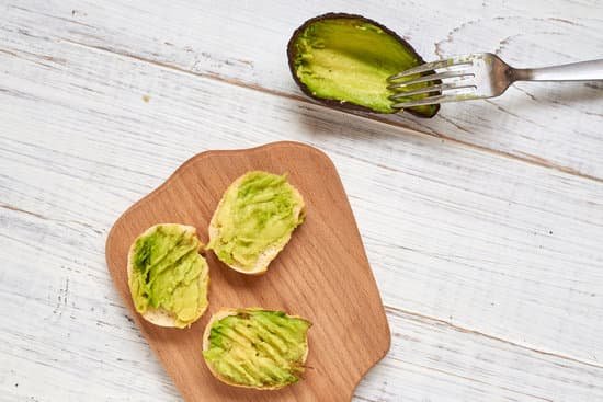 canva baguette slices with avocado on a serving board MAEApzdXJ0s