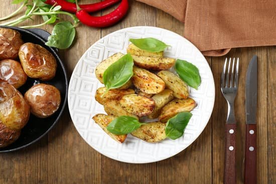 canva baked potatoes with basil leaves on plate MAD MfL 03Q