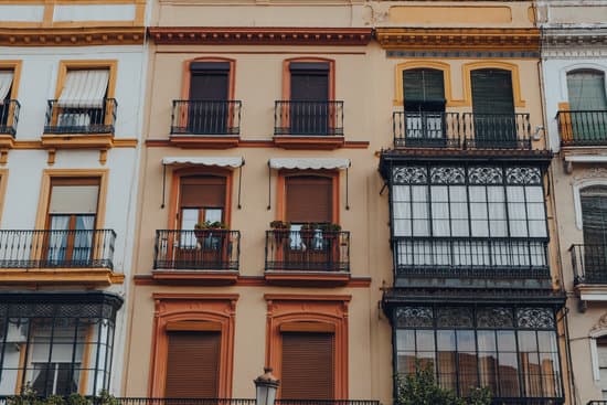 canva balconies and windows of an apartment building MAEVvISj3 E