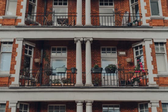 canva balconies of a traditional apartment block in mayfair london uk