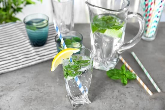 canva basil water in glassware on table MAD9T21GEUQ