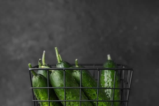 canva basket with green cucumbers on a dark background MAD6rFBvkSc