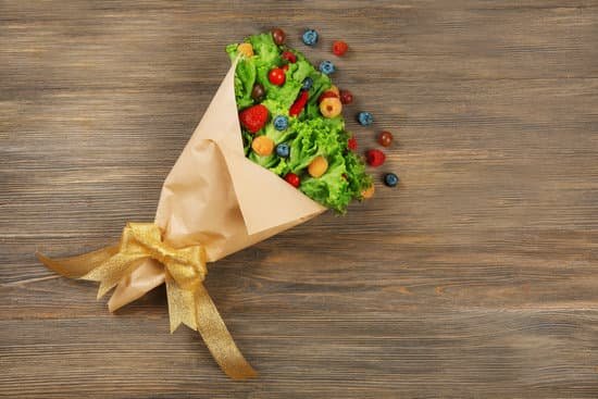 canva beautiful bouquet of lettuce and berries in paper sheet MAD MirBom0