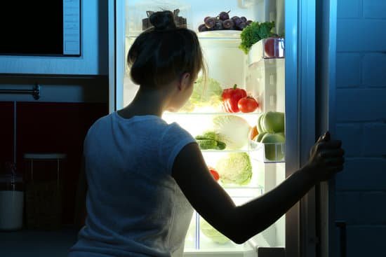 canva beautiful girl searching for food in fridge. hunger concept MAEsehqqb Q