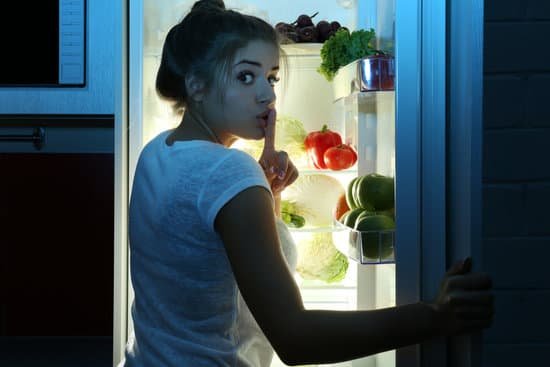 canva beautiful girl searching for food in fridge. hunger concept MAEserUtkTc