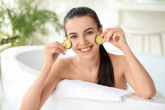 canva beautiful young woman with cucumber slices in bathroom MAD7pPA5Cfw