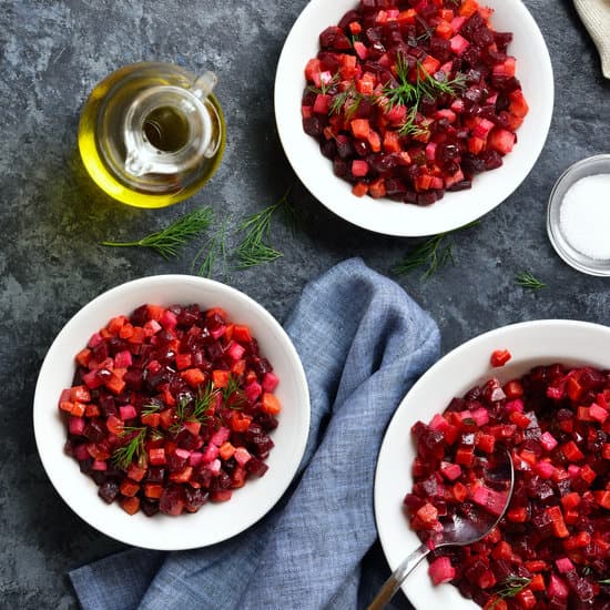 canva beet salad in bowl on blue stone table MAENbKRwDKg