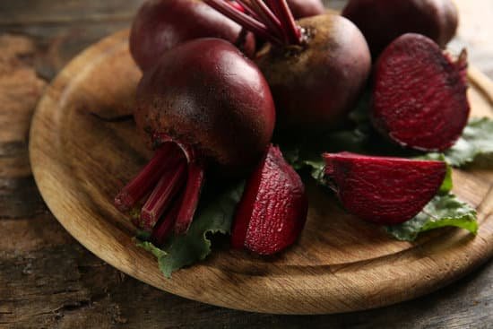 canva beets with leaves on a wooden board MAD MbrUD1s