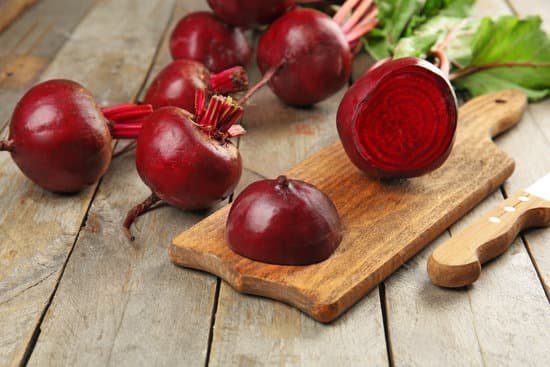 canva beets with leaves on wooden table MAD MTI2eDE