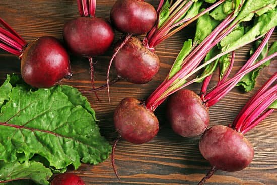 canva beets with leaves on wooden table MAD