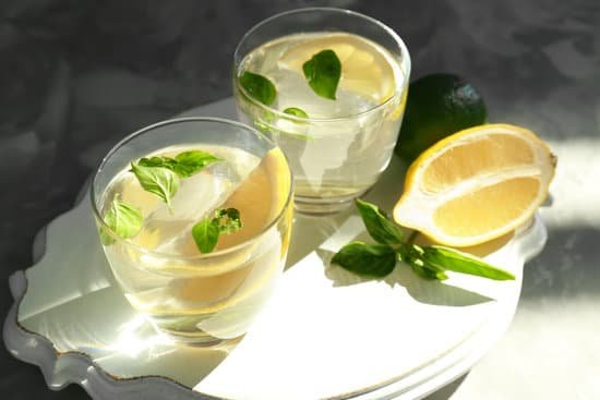 canva board with glasses of basil and lemon water on table