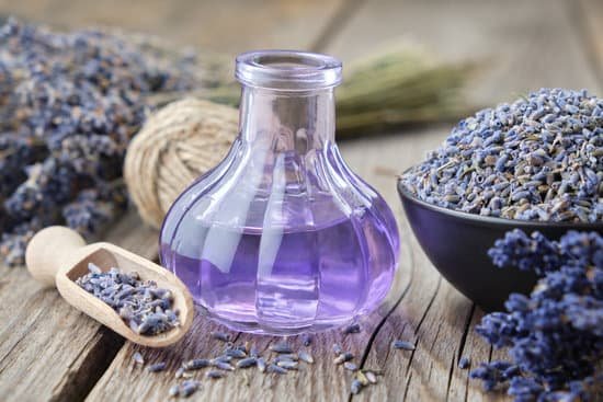 canva bottle of lavender essential oil on a table MAD Pxoe vY