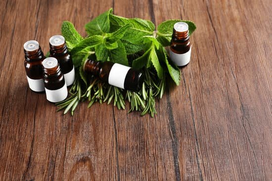 canva bottles and herbs on wooden background MAD