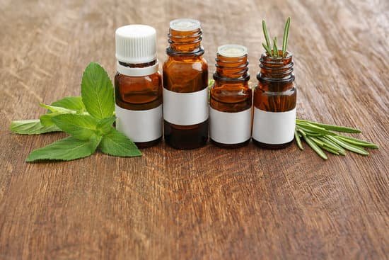 canva bottles and herbs on wooden background MAD QyRycdA