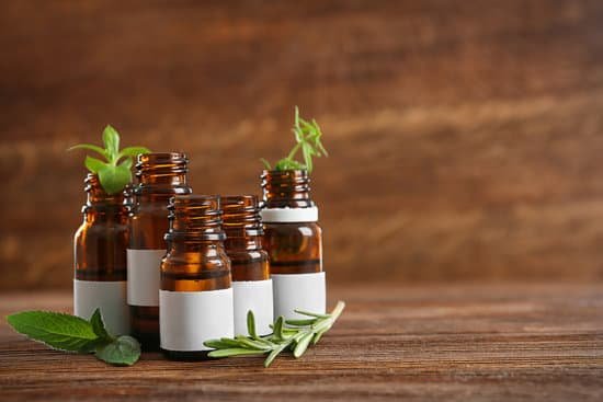 canva bottles and herbs on wooden table MAD Q8zlPy0