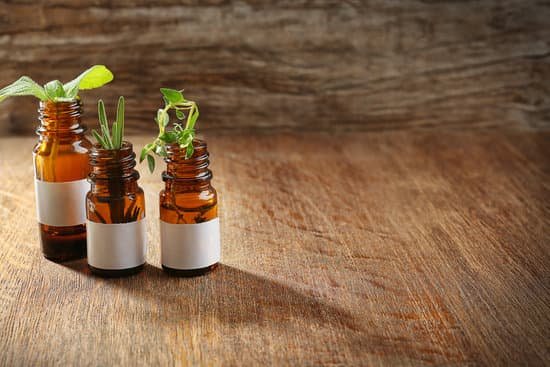 canva bottles and herbs on wooden table MAD