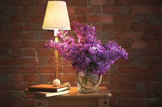 canva bouquet of purple lilac flowers on brick wall background MAD Qs8uGAg