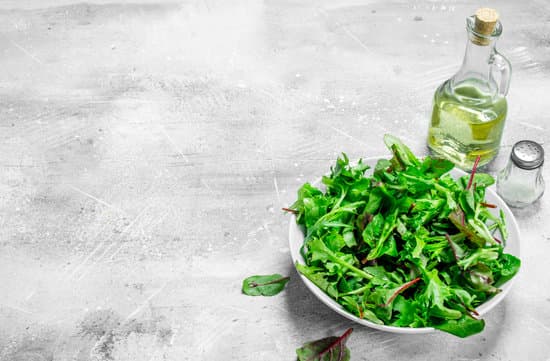 canva bowl of arugula salad with bottles of salt and oil MAEPO3Seno4