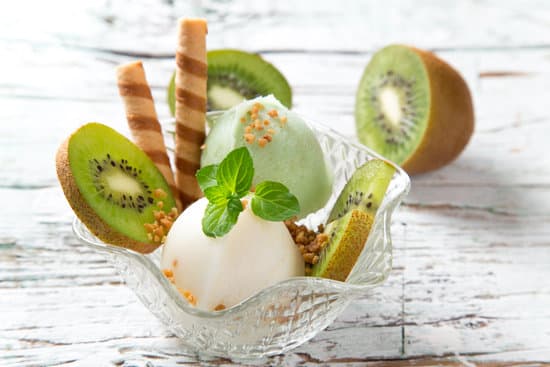 canva bowl of ice cream with kiwi slices and wafer sticks MAEQS6ilaTY