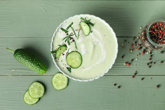 canva bowl with cold cucumber soup on table MAD7yM4BXS4
