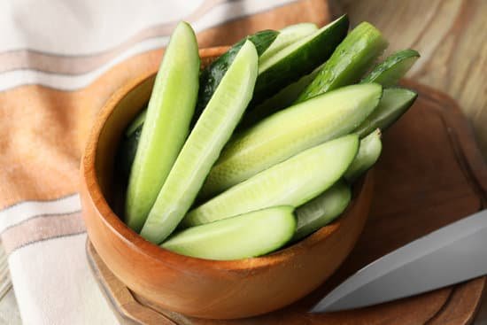 canva bowl with green cucumbers on table MAD6rDCchv0