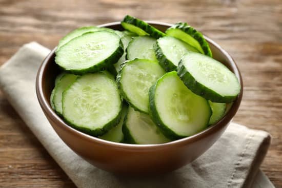 canva bowl with sliced cucumbers on a table MAD9boYB9sM