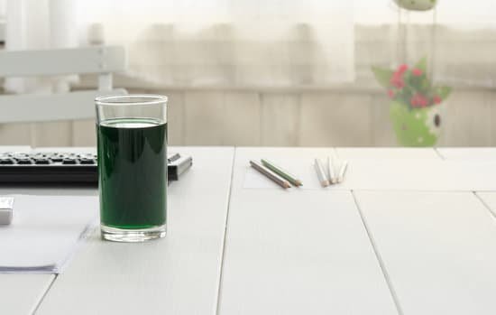 canva chlorophyll in glass on table at home. MADpRyKiJ5Q