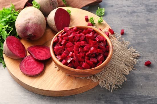 canva chopped fresh beets in bowl on table MAD9bWNeowI