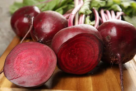 canva close up of beets on wooden board MAD MfUBkyA