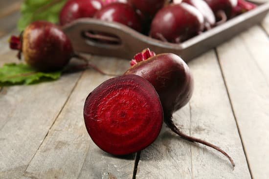 canva close up of beets on wooden table MAD MVPrIpk